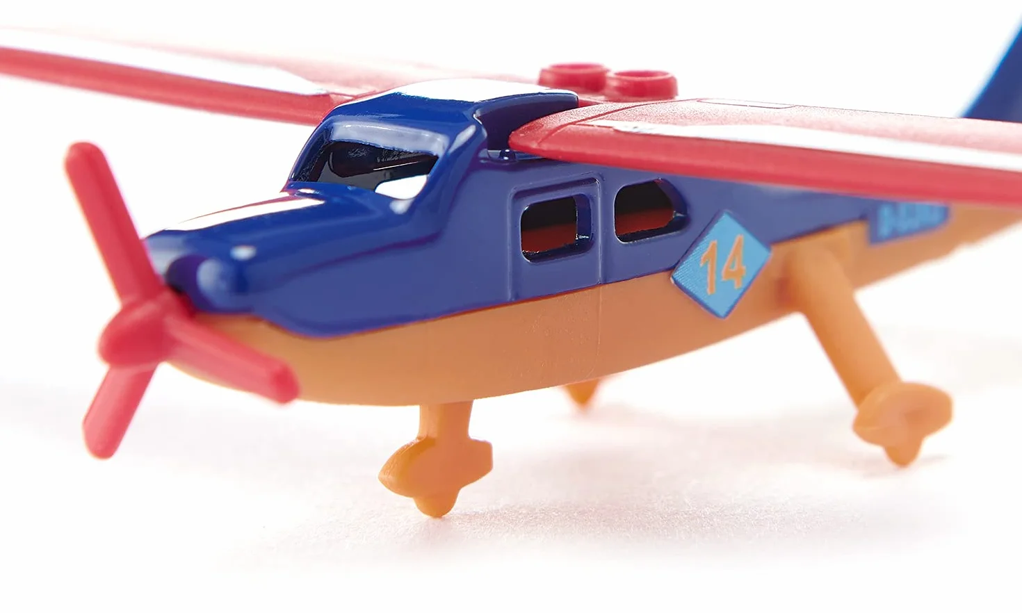 SIKU 1101 Avion Sportif en Métal Plastique Multicolore Hélice Rotative Ailes Rétractables